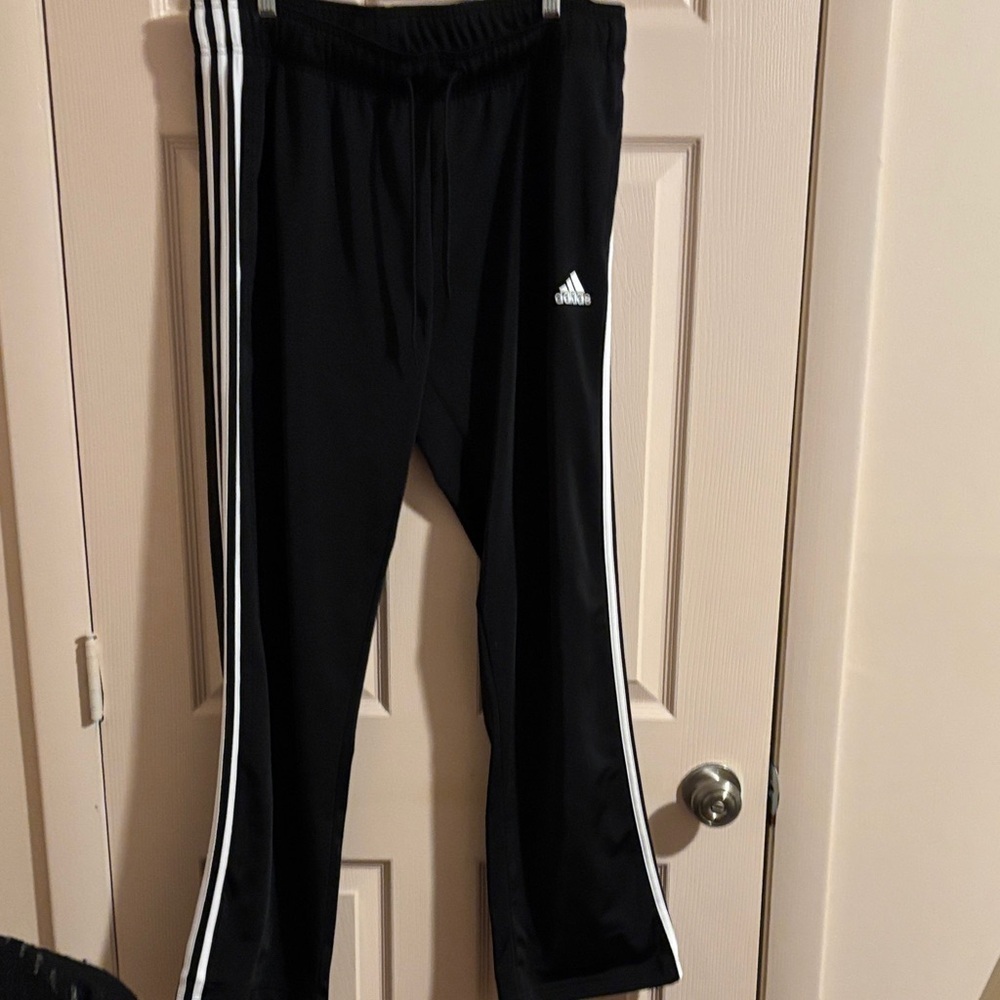 Adidas women’s Black Joggers with White Stripes